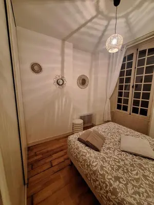 Un ou plusieurs lits dans un hébergement de l'établissement Le Clémenceau face à la Charente 2 chambres