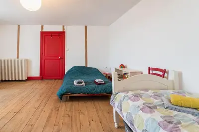 Un ou plusieurs lits dans un hébergement de l'établissement La Moulière family house