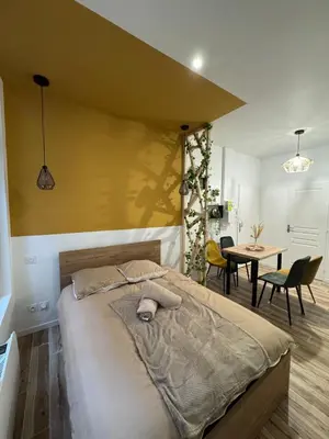 Un ou plusieurs lits dans un hébergement de l'établissement Studio hyper centre le Cosy