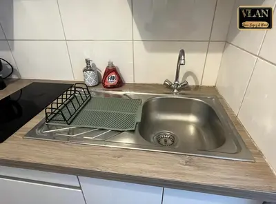 Cuisine ou kitchenette dans l'établissement En bord de Sèvre