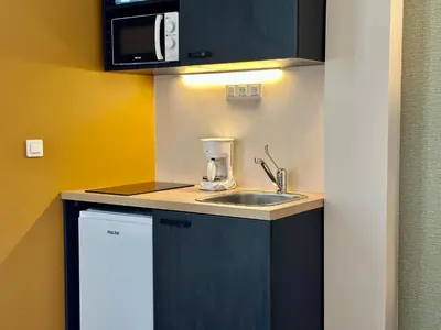 Cuisine ou kitchenette dans l'établissement Smartappart Niort