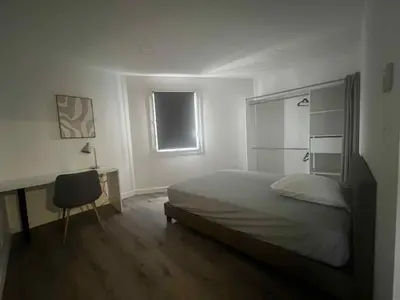 Un ou plusieurs lits dans un hébergement de l'établissement Apt de 110 m2 tout équipé et confortable
