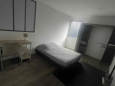 Un ou plusieurs lits dans un hébergement de l'établissement Apt de 110 m2 tout équipé et confortable