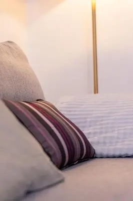 Un ou plusieurs lits dans un hébergement de l'établissement Appartement de l'ammonite