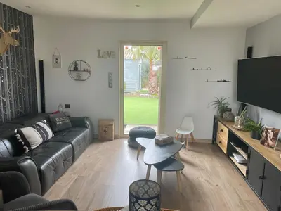 Télévision ou salle de divertissement dans l'établissement Maison de vacances