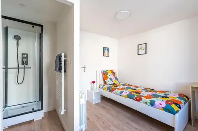 Un ou plusieurs lits dans un hébergement de l'établissement Home in Niort