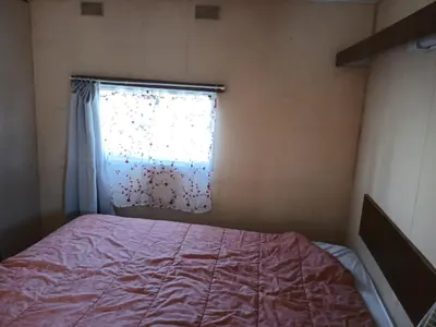 Un ou plusieurs lits dans un hébergement de l'établissement Camping de la cigogne