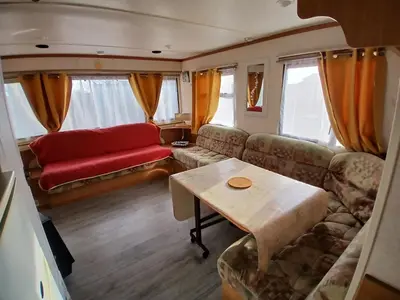 Coin salon dans l'établissement Camping de la cigogne