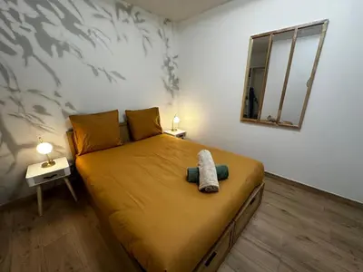 Un ou plusieurs lits dans un hébergement de l'établissement Le tropical - hyper centre - patio - wifi