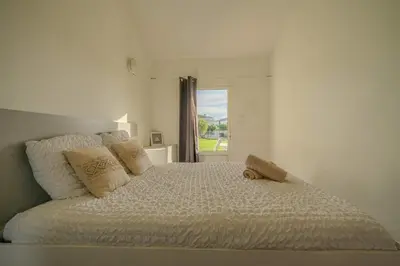 Un ou plusieurs lits dans un hébergement de l'établissement Sunset Aparthotel Kiwi Residence