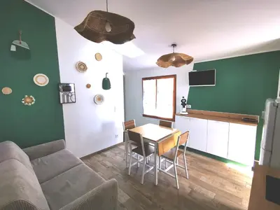 Télévision ou salle de divertissement dans l'établissement L'Aarona du Lidon
