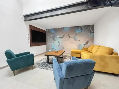 Coin salon dans l'établissement Le loft du canal de Rompsay