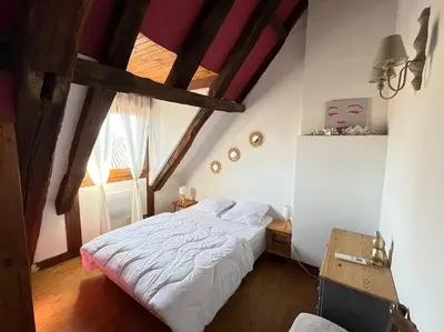 Un ou plusieurs lits dans un hébergement de l'établissement Maison Périgourdine 14 personnes avec piscine