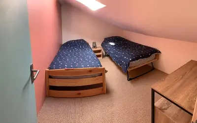 Un ou plusieurs lits dans un hébergement de l'établissement Maison accueillante avec piscine à Chalandray