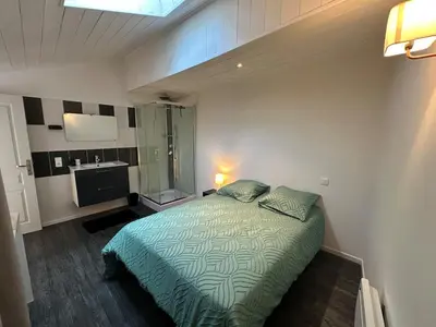Un ou plusieurs lits dans un hébergement de l'établissement Duplex appartement