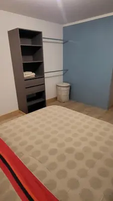 Un ou plusieurs lits dans un hébergement de l'établissement Chambre cosy spatieuse