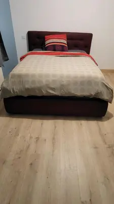 Un ou plusieurs lits dans un hébergement de l'établissement Chambre cosy spatieuse