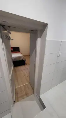 Un ou plusieurs lits dans un hébergement de l'établissement Chambre cosy spatieuse