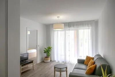 Télévision ou salle de divertissement dans l'établissement Résidence de La Rochelle