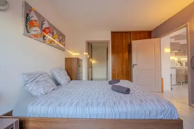 Un ou plusieurs lits dans un hébergement de l'établissement Dunes Apart-Hotel - Kiwi Residence