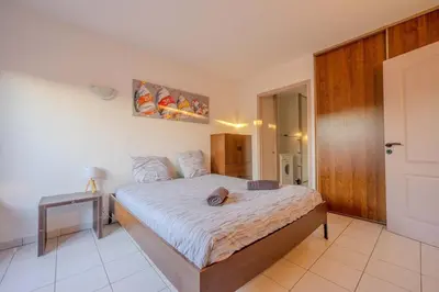 Un ou plusieurs lits dans un hébergement de l'établissement Dunes Apart-Hotel - Kiwi Residence