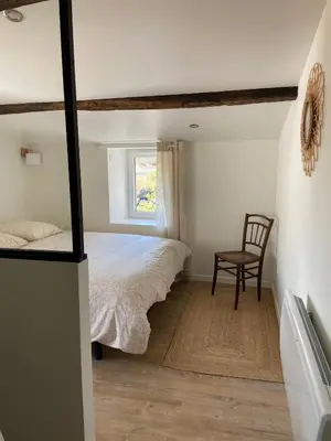 Un ou plusieurs lits dans un hébergement de l'établissement Charmante Maison de Campagne