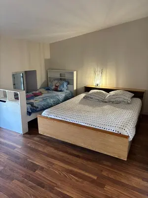 Un ou plusieurs lits dans un hébergement de l'établissement Grand appartement pour 4 à 5 personnes maximum