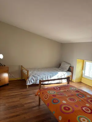 Un ou plusieurs lits dans un hébergement de l'établissement Grand appartement pour 4 à 5 personnes maximum