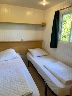 Un ou plusieurs lits dans un hébergement de l'établissement Camping du Fouilloux