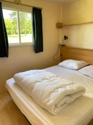 Un ou plusieurs lits dans un hébergement de l'établissement Camping du Fouilloux