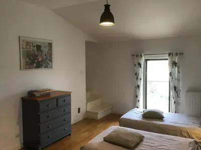 Un ou plusieurs lits dans un hébergement de l'établissement Le clos de la huppe - suite familiale