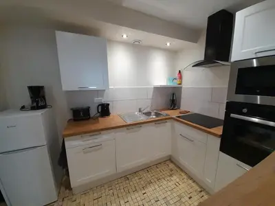 Cuisine ou kitchenette dans l'établissement Gite VILLENEUVE LA COMTESSE