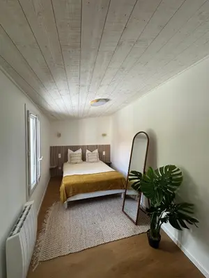 Un ou plusieurs lits dans un hébergement de l'établissement Maison Cosy Niort parking privé 3 chambres