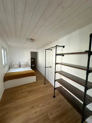 Un ou plusieurs lits dans un hébergement de l'établissement Maison Cosy Niort parking privé 3 chambres