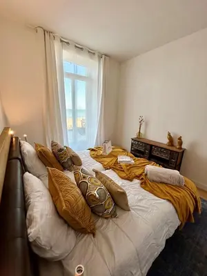 Un ou plusieurs lits dans un hébergement de l'établissement La Villa Ô Dunes Front de Mer