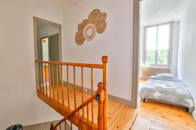 Un ou plusieurs lits dans un hébergement de l'établissement La maison du Bonheur