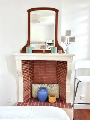 Un ou plusieurs lits dans un hébergement de l'établissement Charmant appartement cosy en plein centre