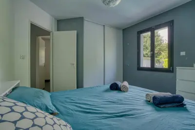 Un ou plusieurs lits dans un hébergement de l'établissement Villa Moderne Piscine - 6p - Calme - Angoulême