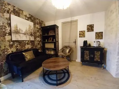 Coin salon dans l'établissement Chambre chez l'habitant
