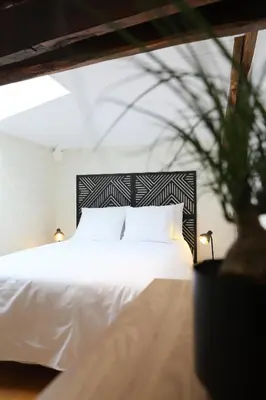 Un ou plusieurs lits dans un hébergement de l'établissement Au Lit D'Ô