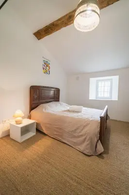 Un ou plusieurs lits dans un hébergement de l'établissement La Bégasserie Ancienne maison de maître de 1700