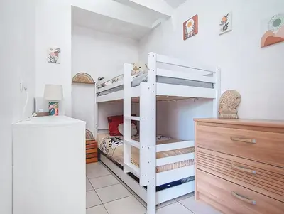 Un ou plusieurs lits dans un hébergement de l'établissement La Colline - Surgères - Maison 2 chambres, jacuzzi, sauna, jardin, entre mer et campagne