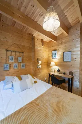 Un ou plusieurs lits dans un hébergement de l'établissement Le Chalet de Limbre
