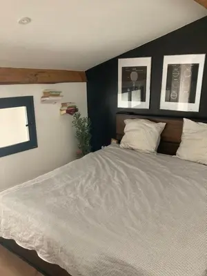 Un ou plusieurs lits dans un hébergement de l'établissement Loft centre ville à saintes