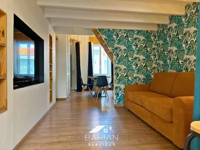Coin salon dans l'établissement 7min de la plage - Maison typique - Cour privative