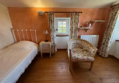 Un ou plusieurs lits dans un hébergement de l'établissement Chambre d'hôtes Les Bleuets