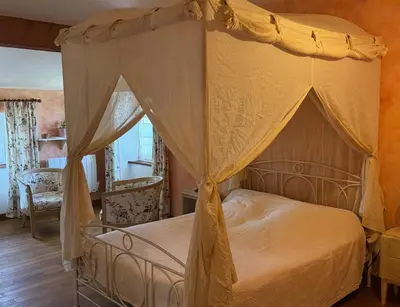 Un ou plusieurs lits dans un hébergement de l'établissement Chambre d'hôtes Les Bleuets