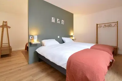 Un ou plusieurs lits dans un hébergement de l'établissement Gîte de la Chaize
