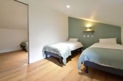 Un ou plusieurs lits dans un hébergement de l'établissement Gîte de la Chaize