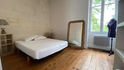 Un ou plusieurs lits dans un hébergement de l'établissement Maison en hyper centre, à 50 mètres de la plage